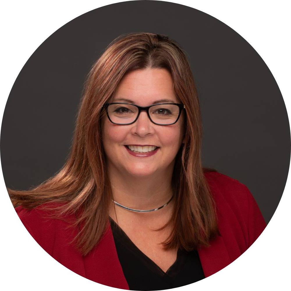 Deb Sanders smiling for her GVSU headshot